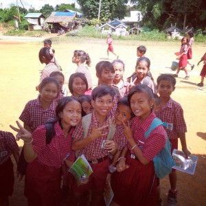 Elementary school students in Batu Mas village pose with endangered species coloring books published by GPOCP, with support from Orangutan Outreach. 