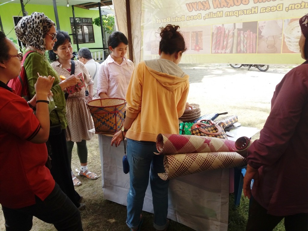 Customers from Kayong Utara regency visit our NTFP artisan's booth at a festival in December.  